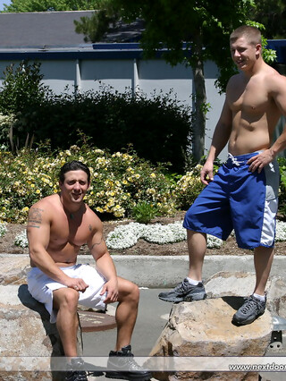 Muscular gay studs Tommy D & Hoyce flaunting their mighty chests outdoors