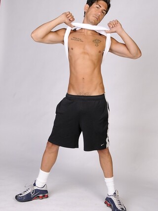 Good-looking gay hunk Jack Spade shows off his athletic body & tattoos