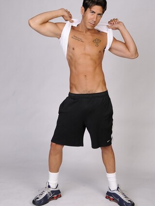 Good-looking gay hunk Jack Spade shows off his athletic body & tattoos