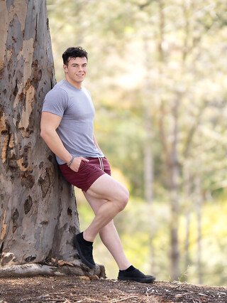 Hunky gay bodybuilder Clark Reid flashes his ass outdoors before posing naked